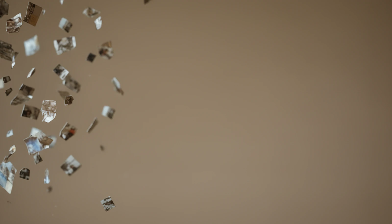 Scattered fragments of photos floating against a warm beige background, evoking digital disarray